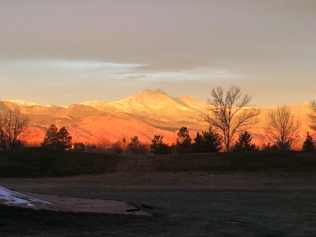Sunrise hitting Longs Peak and Mount Meeker, taken from the Twin Peaks golf course in Longmont, Colorado.